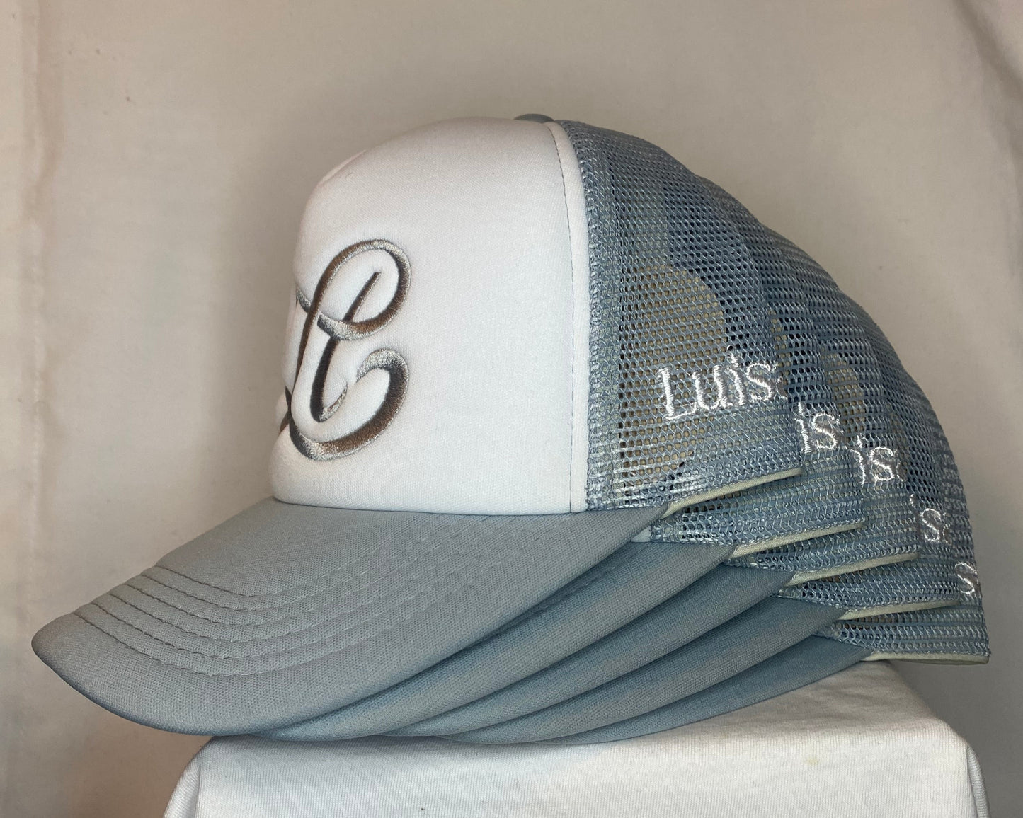 Gray cap with a logo on a white surface