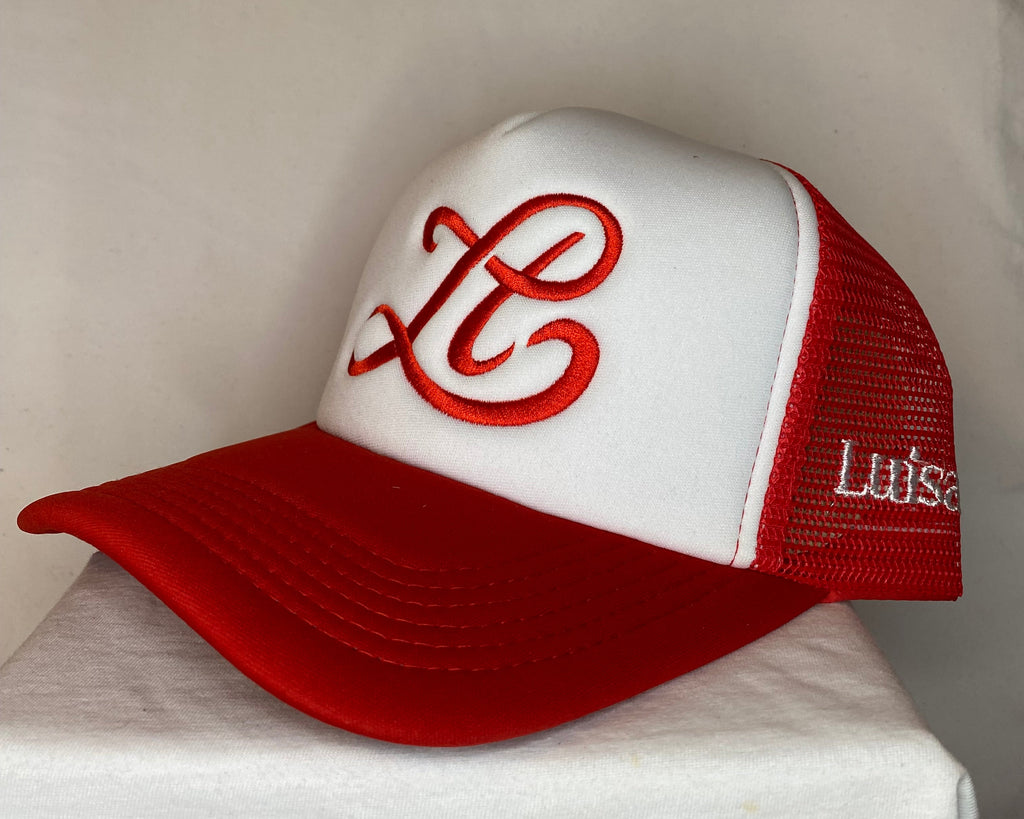 Red and white golf club head cover with a logo on a neutral background